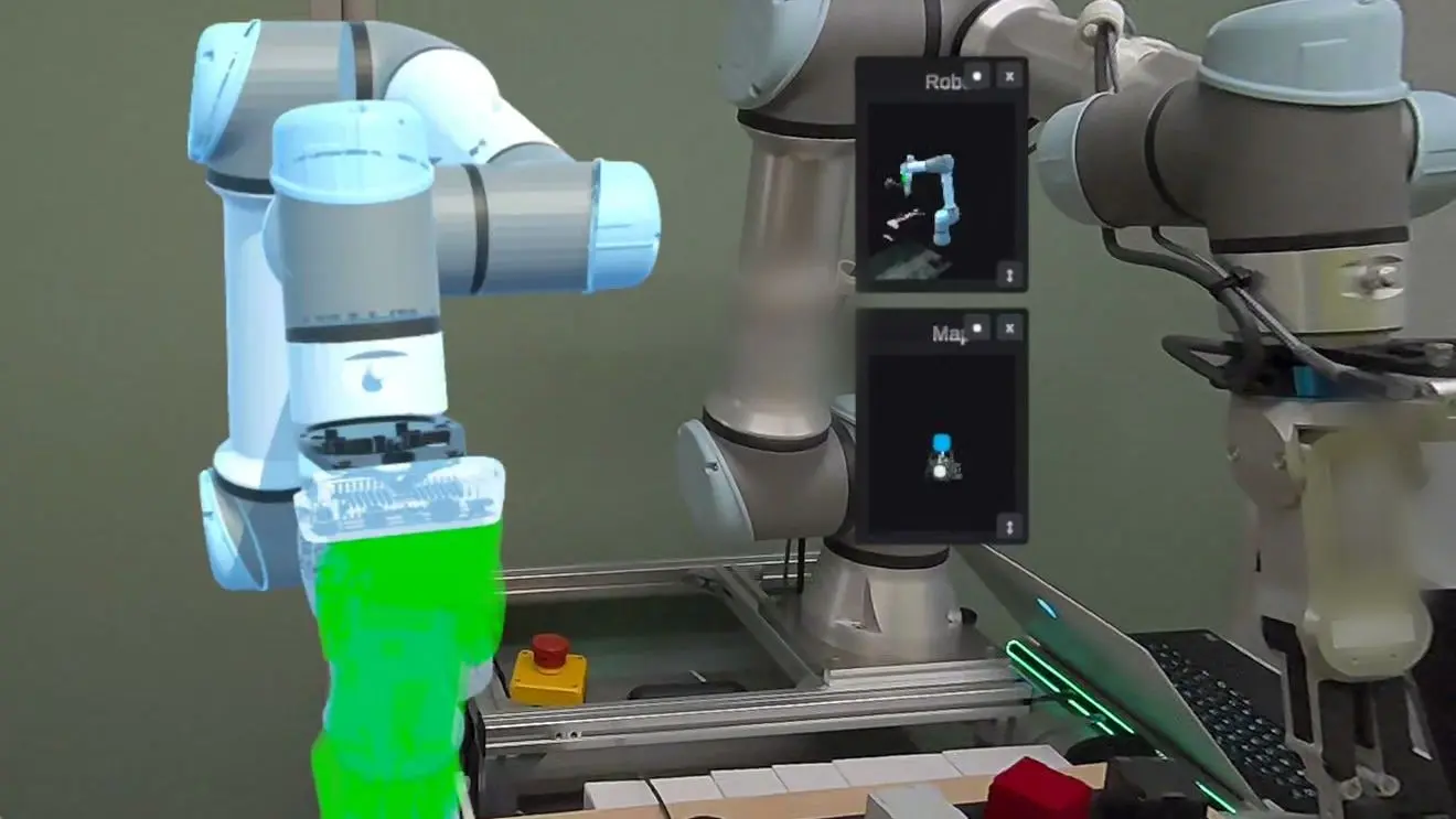 The hologram of a robot arm and the green target pose of its gripper in the real room, seen through a headset